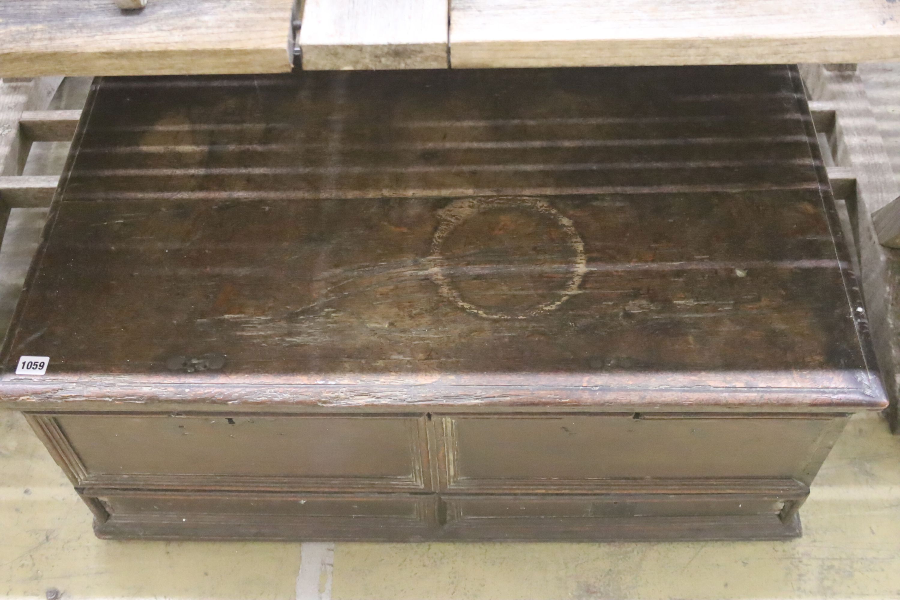 An 18th century oak trunk with dummy drawer front, width 92cm, depth 53cm, height 39cm